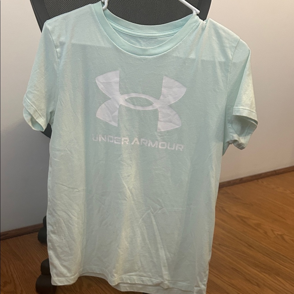 Greenish light teal woman’s under Armour tee